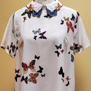 Butterfly patterned on white polyester blouse, size M